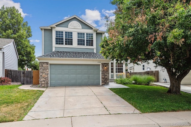 2780 S Cathay Ct, Aurora, CO 80013 - traditional-style home with a garage, concrete driveway, stone siding, and a shingled roof