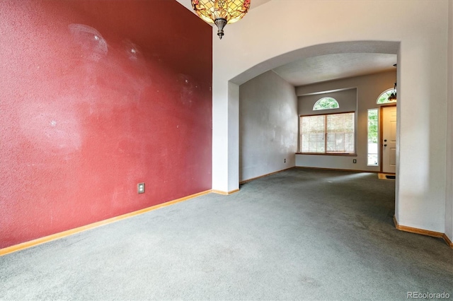 2780 S Cathay Ct, Aurora, CO 80013 - empty room with arched walkways and carpet flooring