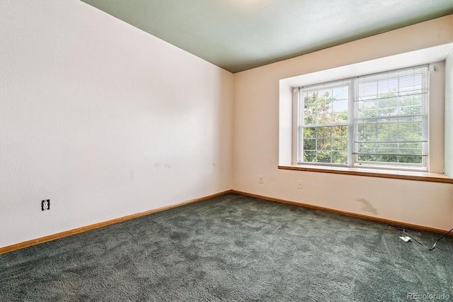 2780 S Cathay Ct, Aurora, CO 80013 - empty room featuring dark carpet and baseboards