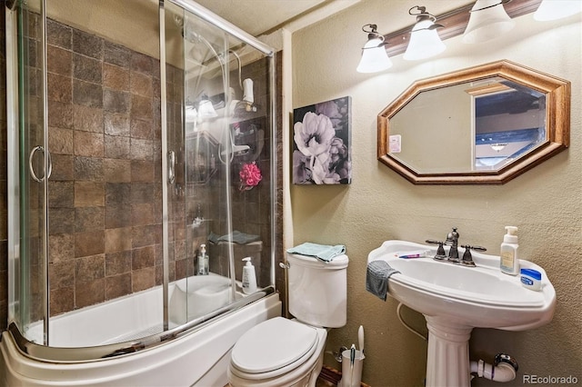 2780 S Cathay Ct, Aurora, CO 80013 - bathroom featuring combined bath / shower with glass door and a textured wall