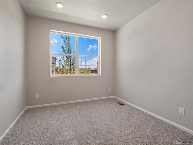 unfurnished room featuring carpet floors