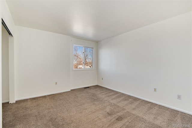 spare room with carpet floors