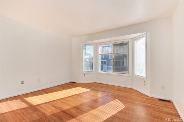 unfurnished room featuring light hardwood / wood-style flooring