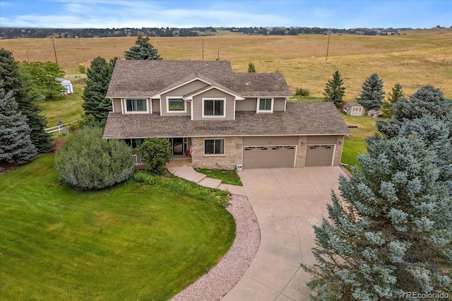 view of front of home featuring a garage and a front lawn