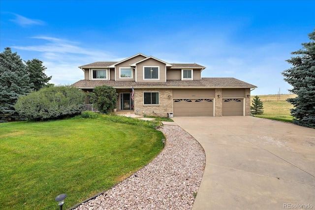 view of front of house featuring a front yard and a garage