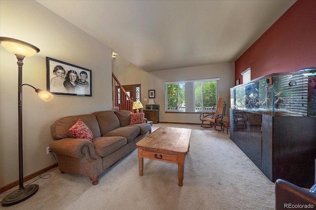 living room featuring light carpet and vaulted ceiling