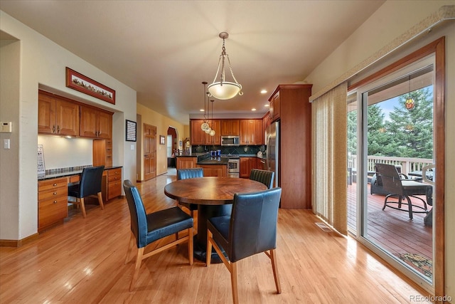 dining area with light hardwood / wood-style flooring