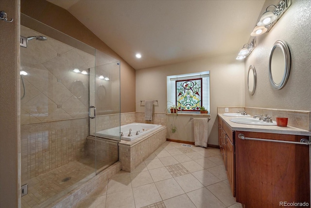 bathroom with lofted ceiling, vanity, tile patterned flooring, and independent shower and bath