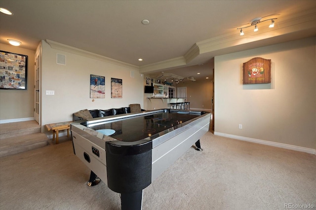 playroom featuring indoor bar, ornamental molding, light carpet, and rail lighting