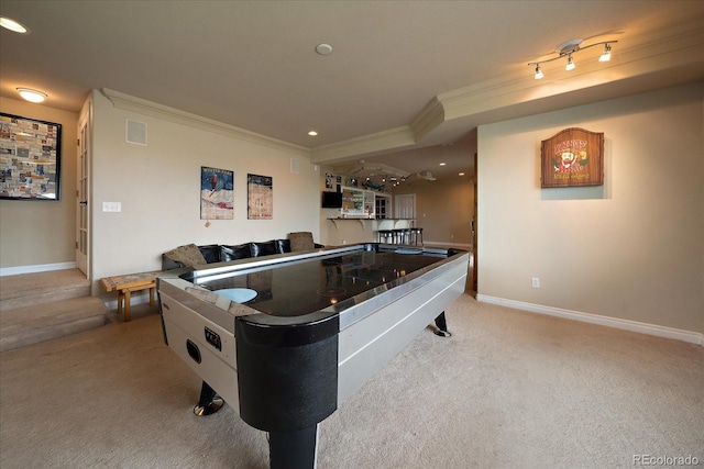 rec room with light carpet and crown molding