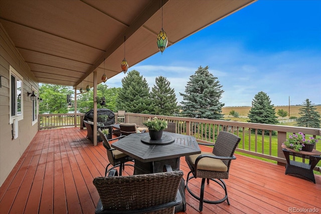 wooden terrace featuring a grill