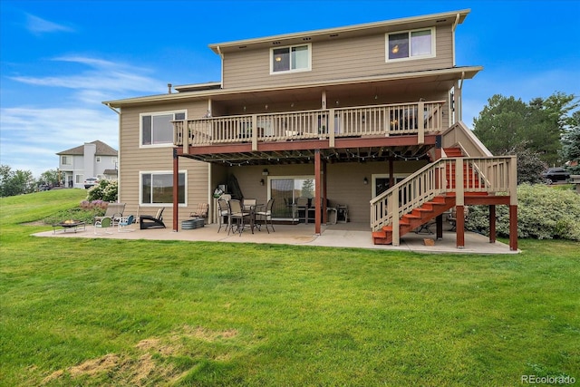 back of house with a patio, a deck, and a yard