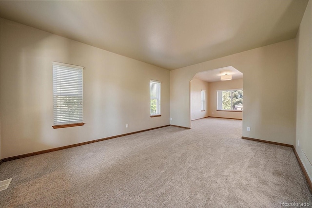 5861 E Valley Hi Dr, Parker, CO 80138 - spare room with light carpet and arched walkways