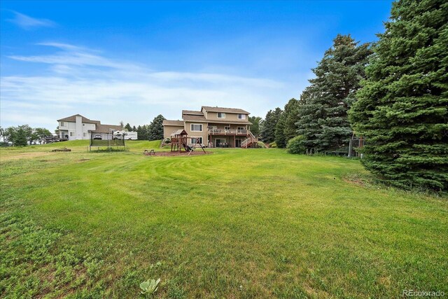 5861 E Valley Hi Dr, Parker, CO 80138 - view of grassy yard featuring stairway and a wooden deck