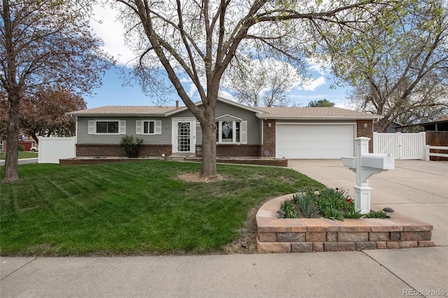 ranch-style house with a garage, fence, a front yard, brick siding, and driveway