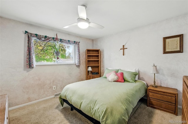 bedroom with baseboards, carpet flooring, and ceiling fan