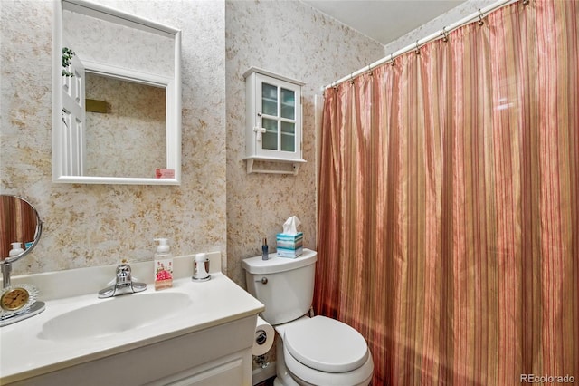 full bathroom with toilet, wallpapered walls, a shower with shower curtain, and vanity