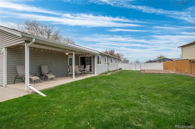 view of yard with a patio and a fenced backyard