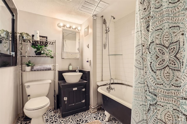 1376 N Pearl St Unit B1, Denver, CO 80203 - bathroom featuring visible vents, toilet, vanity, shower / tub combo with curtain, and a textured ceiling