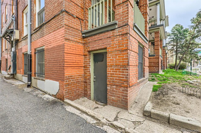 1376 N Pearl St Unit B1, Denver, CO 80203 - doorway to property with brick siding and a balcony