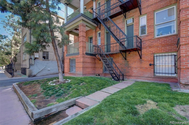 1376 N Pearl St Unit B1, Denver, CO 80203 - exterior space featuring a lawn, brick siding, and central air condition unit