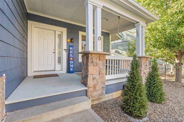 1540 Meachum Way, Erie, CO 80516 - view of exterior entry featuring covered porch