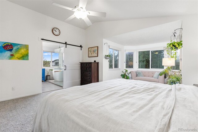 1540 Meachum Way, Erie, CO 80516 - carpeted bedroom with a barn door, multiple windows, vaulted ceiling, baseboards, and a ceiling fan