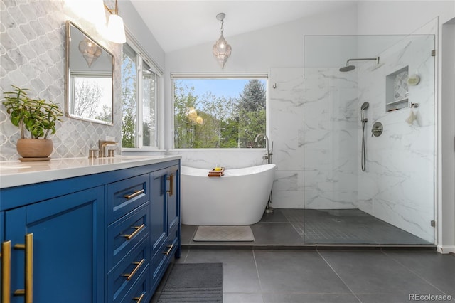 1540 Meachum Way, Erie, CO 80516 - bathroom with lofted ceiling, vanity, plenty of natural light, a marble finish shower, and a soaking tub