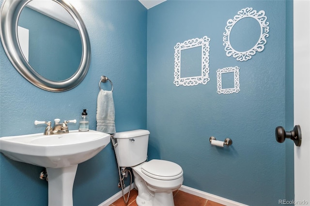 1540 Meachum Way, Erie, CO 80516 - bathroom with tile patterned flooring, toilet, baseboards, and a sink