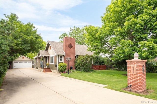 3317 Harlan St, Wheat Ridge, CO 80033 - view of front of property with an outbuilding, a chimney, roof with shingles, and a garage