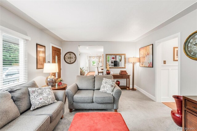 3317 Harlan St, Wheat Ridge, CO 80033 - living area featuring light colored carpet and baseboards