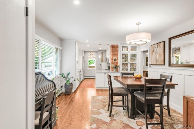 3317 Harlan St, Wheat Ridge, CO 80033 - dining space featuring light wood finished floors, a baseboard heating unit, and recessed lighting