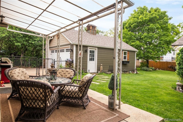 3317 Harlan St, Wheat Ridge, CO 80033 - view of patio / terrace with a pergola and a garage