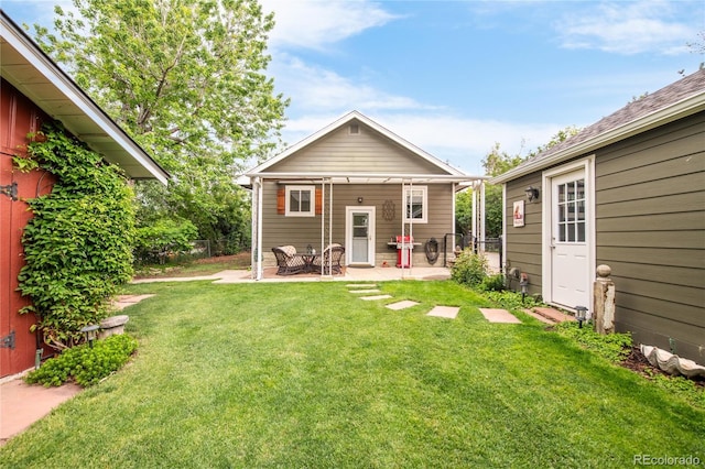 3317 Harlan St, Wheat Ridge, CO 80033 - rear view of house featuring a patio area