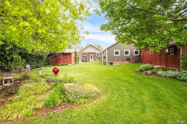 3317 Harlan St, Wheat Ridge, CO 80033 - view of grassy yard with an outbuilding