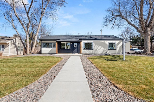 single story home featuring a front lawn