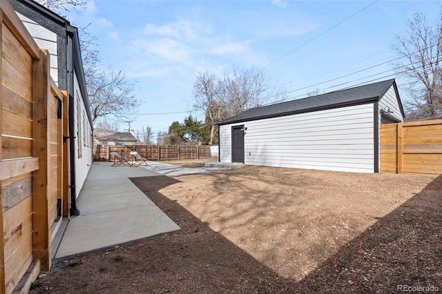 garage with fence