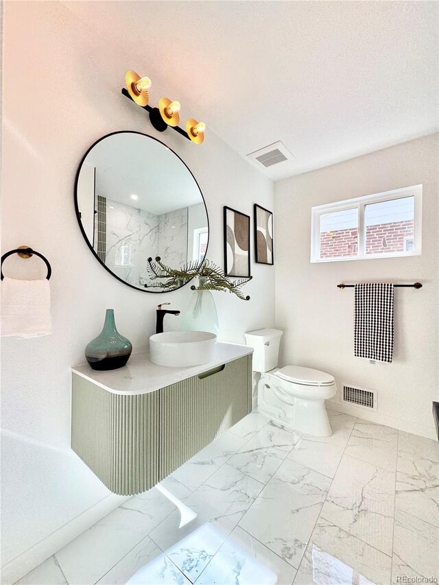 full bathroom with vanity, visible vents, marble finish floor, and toilet