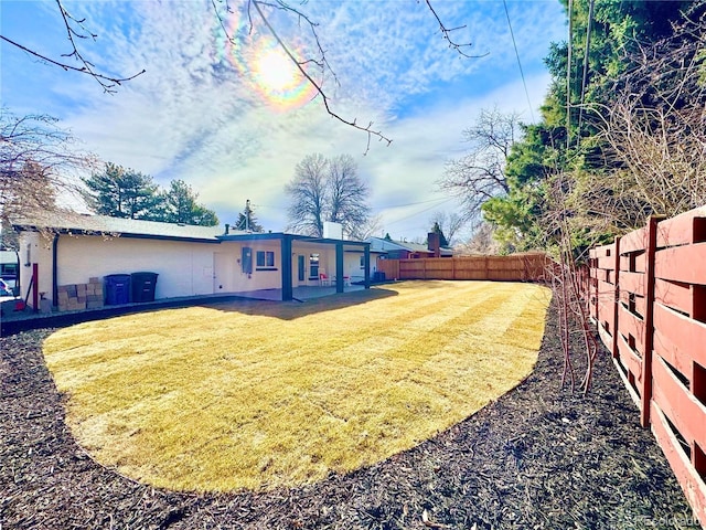 view of yard featuring a fenced backyard
