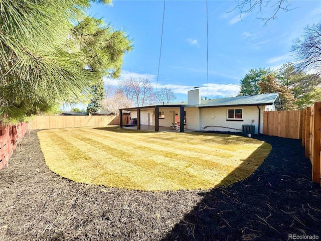 back of house with a patio area, a chimney, a fenced backyard, and central AC unit