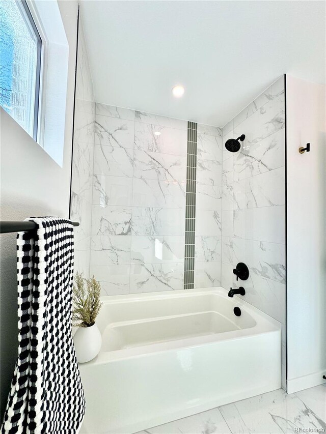 full bathroom with washtub / shower combination, marble finish floor, and recessed lighting