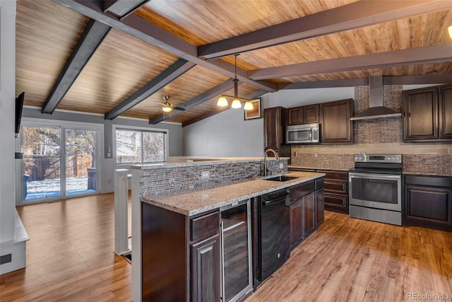 kitchen with dark brown cabinetry, sink, wall chimney exhaust hood, stainless steel appliances, and vaulted ceiling with beams