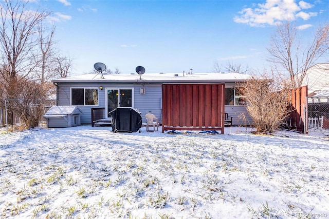 view of snow covered house