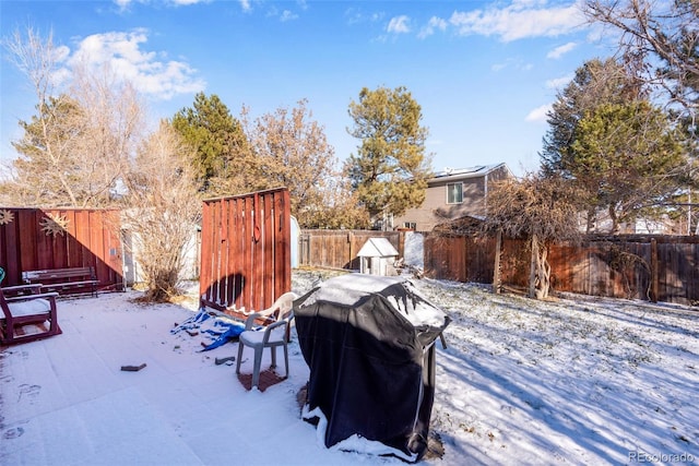 view of yard layered in snow