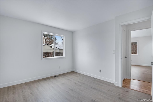 unfurnished room with light hardwood / wood-style flooring