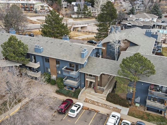 birds eye view of property with a residential view