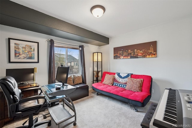 carpeted office space featuring baseboards