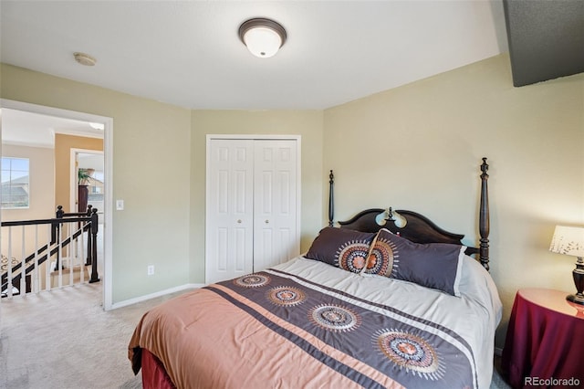 bedroom featuring a closet, carpet, and baseboards