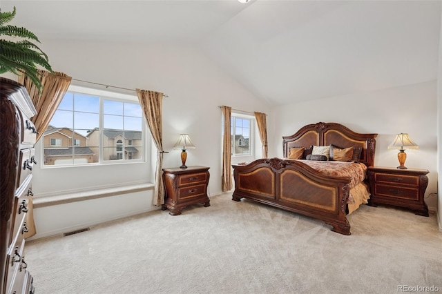 bedroom featuring carpet floors, visible vents, and vaulted ceiling