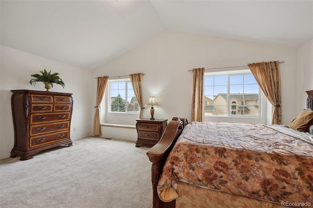 carpeted bedroom featuring vaulted ceiling
